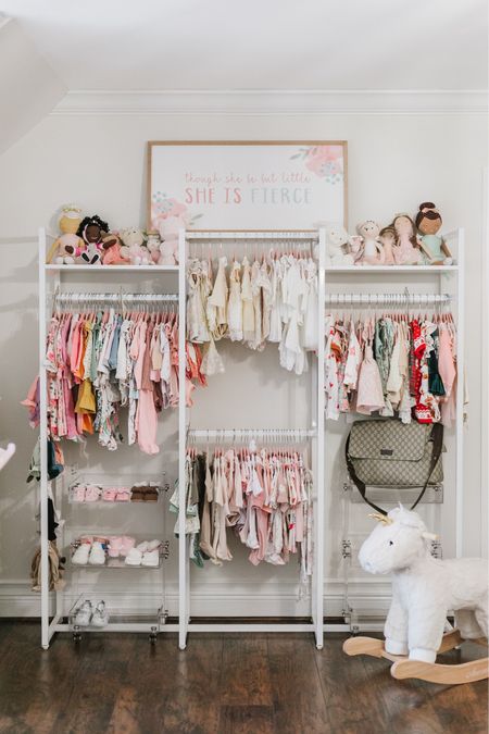 Transforming our baby girl's nursery with the perfect touch of style and functionality! This clothing rack is a game-changer, offering versatility for her adorable outfits. Paired with Acrylic carts for her tiny shoes!  #SweetBabySpace #OrganizedMomLife #NurseryJoys #ChicMomSpaces #AdorableChaos #WayfairWonders #TinyTrendsetter #MomLifeMustHaves #BabyRoomGlam #NurseryVibes #FashionableMotherhood #MomAndBabyStyle #CuteAndCozyNursery #WayfairForMoms #BabyLove #MomLifeDecor