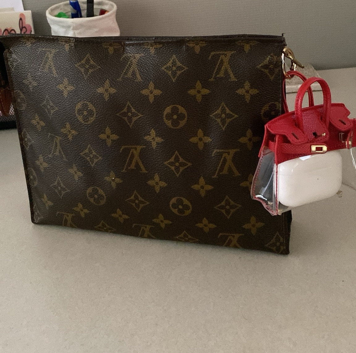 Doing what I can to find  joy (like getting this adorable bag trinket for my airpods 🤭  

#LTKStyleTip #LTKItBag #LTKSaleAlert