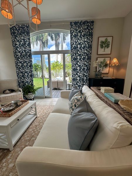 Coastal living room sources, affordable sofa, pillows, white coffee table, blue and white curtains, patterned curtains 

#LTKhome