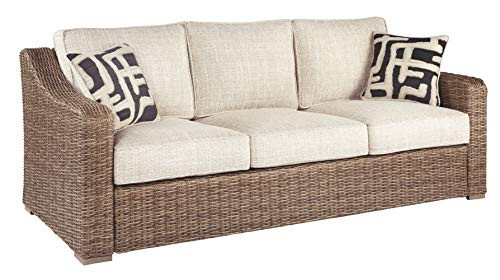 Signature Design by Ashley Beachcroft Outdoor Wicker Patio Sofa with Cushion and 2 Pillows, Beige | Amazon (US)