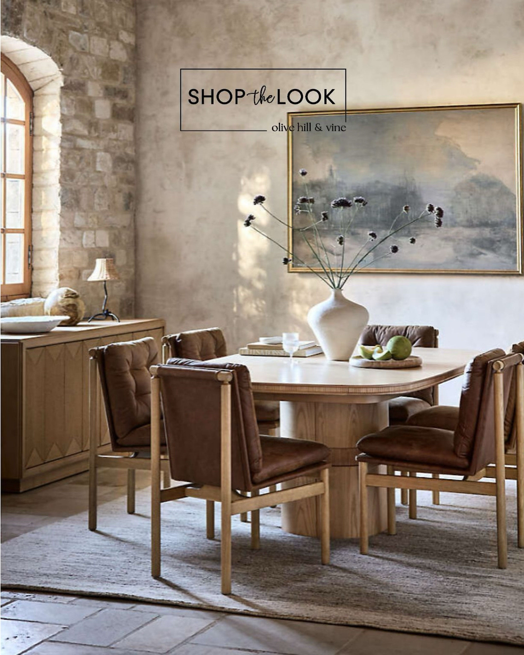 This dining room is all about warmth and texture. A landscape oil painting in an antique gold and black frame sets the tone, paired with a hand-knotted ombre rug, a reeded pedestal dining table, a twisted-rope credenza, a plaster vase, and tailored dining chairs with crosshatch pintucks. 

#LTKFamily #LTKHome #LTKStyleTip