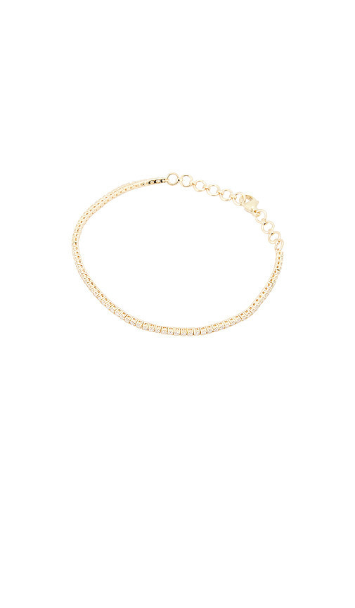 STONE AND STRAND The Essential Dainty Tennis Bracelet in Metallic Gold. | Revolve Clothing (Global)