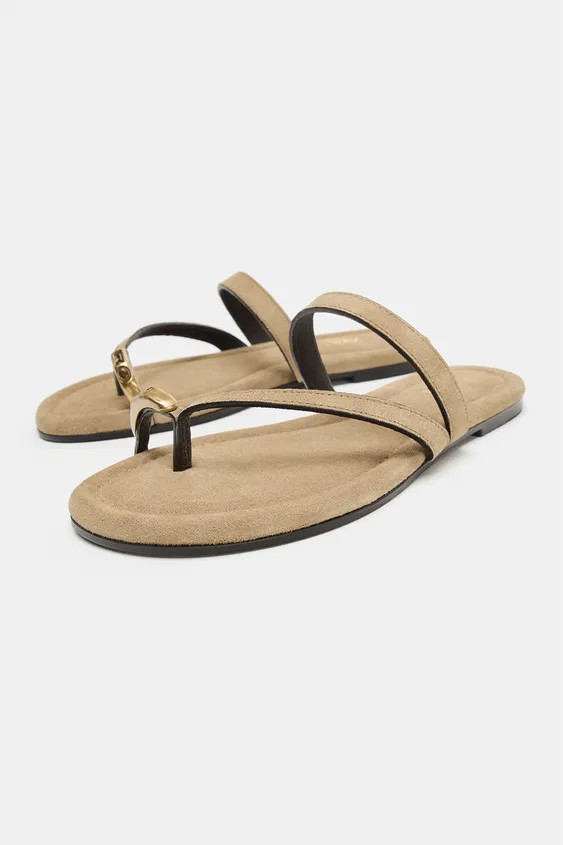 Flat suede sandals. Front strap with toe loop and metallic appliqué detail. Instep strap. Rounded toe.

Sole height: 0.4 inches (1 cm) | Zara US