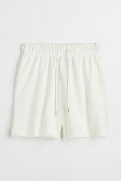 Sweatshorts in lightweight, cotton-blend fabric. High waist, drawstring waistband with covered el... | H&M (US + CA)