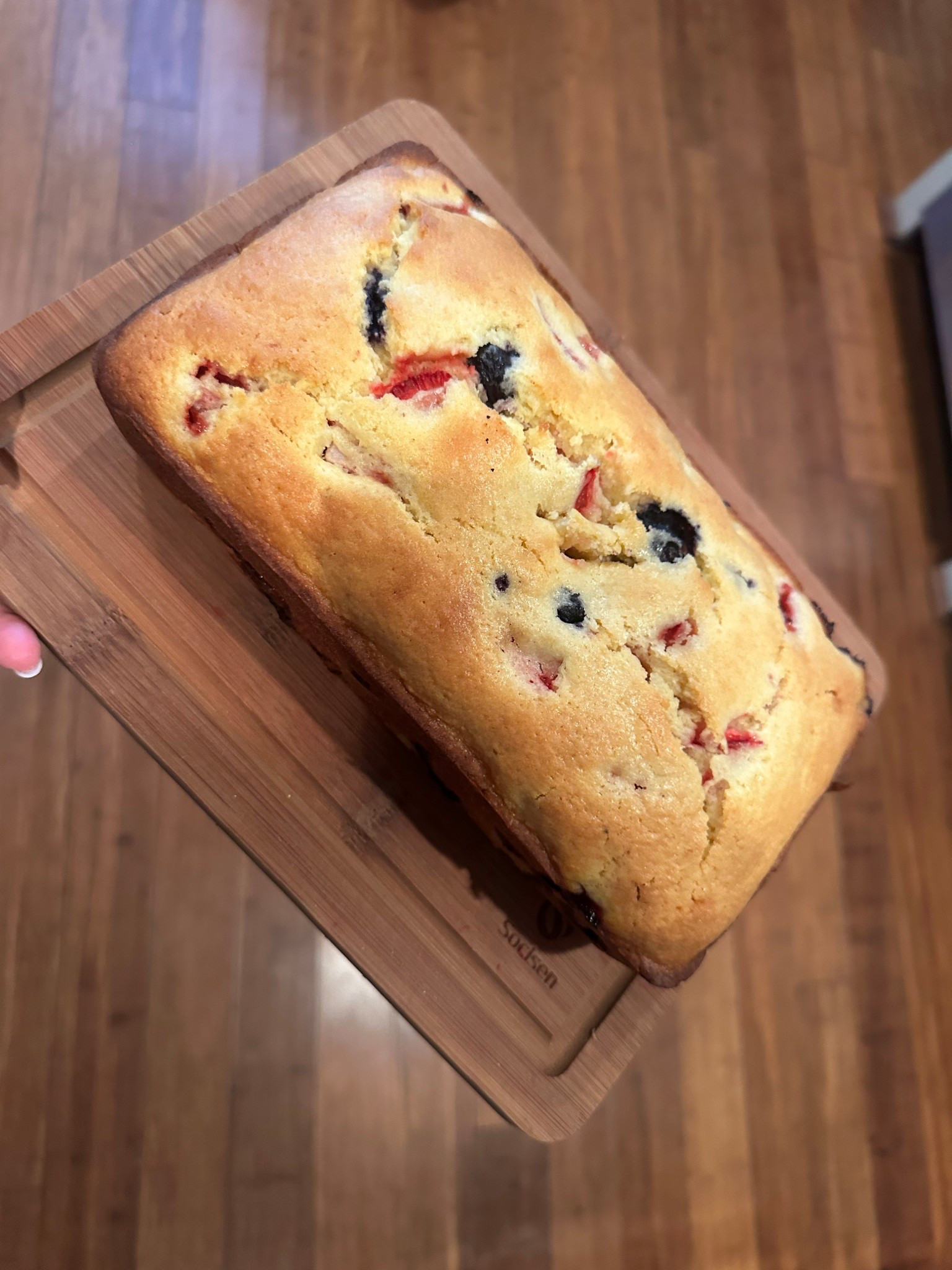 Berry loaf cake 🤌🏼

INGREDIENTS:
Strawberries, Blueberries, unsalted butter, sugar, eggs, lemon, all purpose flour, baking powder
DIRECTIONS:
-preheat oven to 350°, grease loaf pan (9inx4in)
-in a large mixing bowl with hand mixer or stand mixer on medium 2/3cup sugar, 3 eggs, and zest from the lemon
-melt 1/2cup butter and add to same bowl along with juice from the lemon and mix
-add 1.5 cups flour and 1 teaspoonbaking powder and mix
- fold in a cup of strawberries (tops cut off and cut into 4s) and cup of blueberries with a spatula until mixed
-pour into greased loaf pan
-cook in oven for 45-50 mins/until toothpick can be inserted and come out clean
-remove from oven and allow to cool for 30 mins in pan
-remove from pan and cut to serve

Sliced up in my fave bamboo cutting boards! 

#LTKHome #LTKFindsUnder50 #LTKFamily