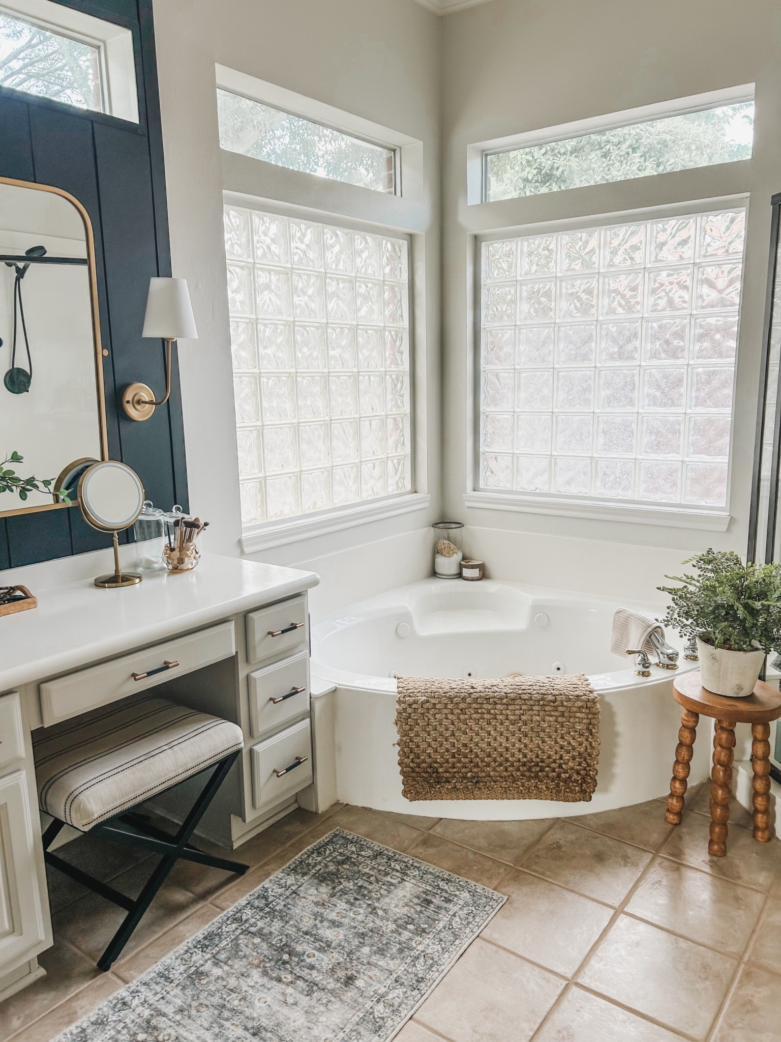 Our bathroom- trying to update with little cosmetic things! 


Bathroom styling, bathroom stool, faux fern, potted plants, corner tub 