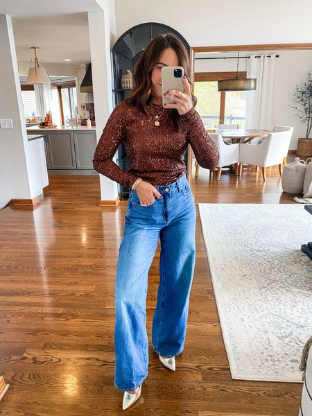 Sequin long sleeve top. Color: hot chocolate. I also have the gold combo. 
LOVE! 
Sized up one to a small. It’s a little roomy. 
Jeans down one size to 24

#LTKHoliday #LTKover40 #LTKxMadewell