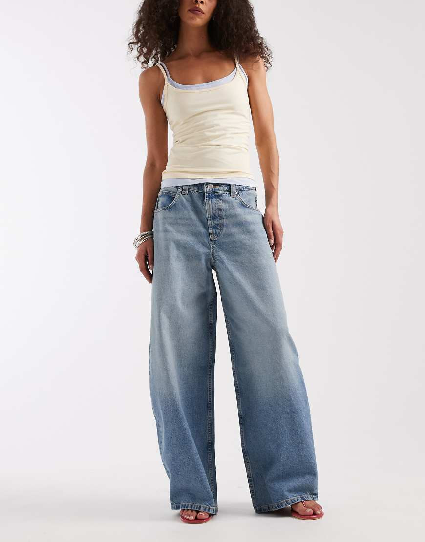 ASOS DESIGN baggy horseshoe jean in light mid wash-Blue | ASOS (Global)