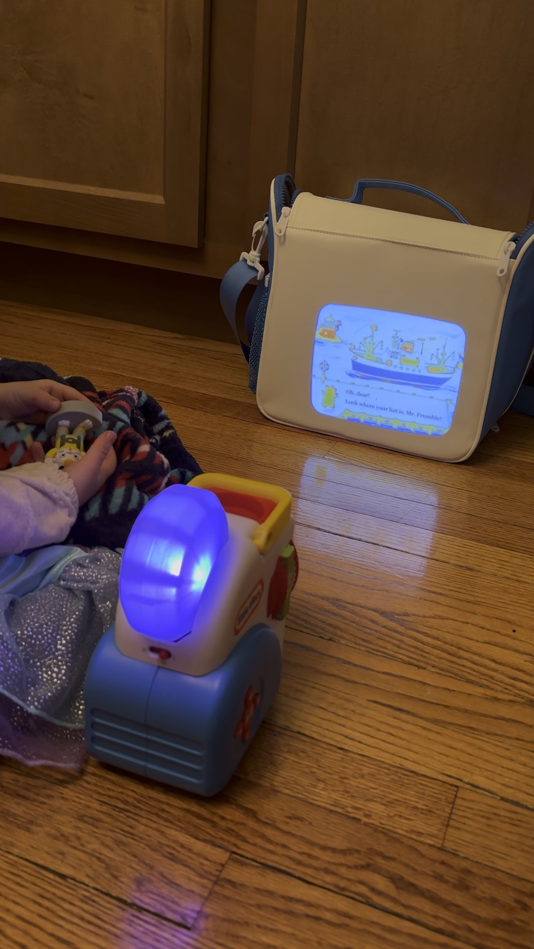 Little Tikes Story Dream Machine is SO cute. We use it for getting our toddler to rest before naptime. Projects anywhere with batteries, durable, and has sound machine features. We love the carrying case too!