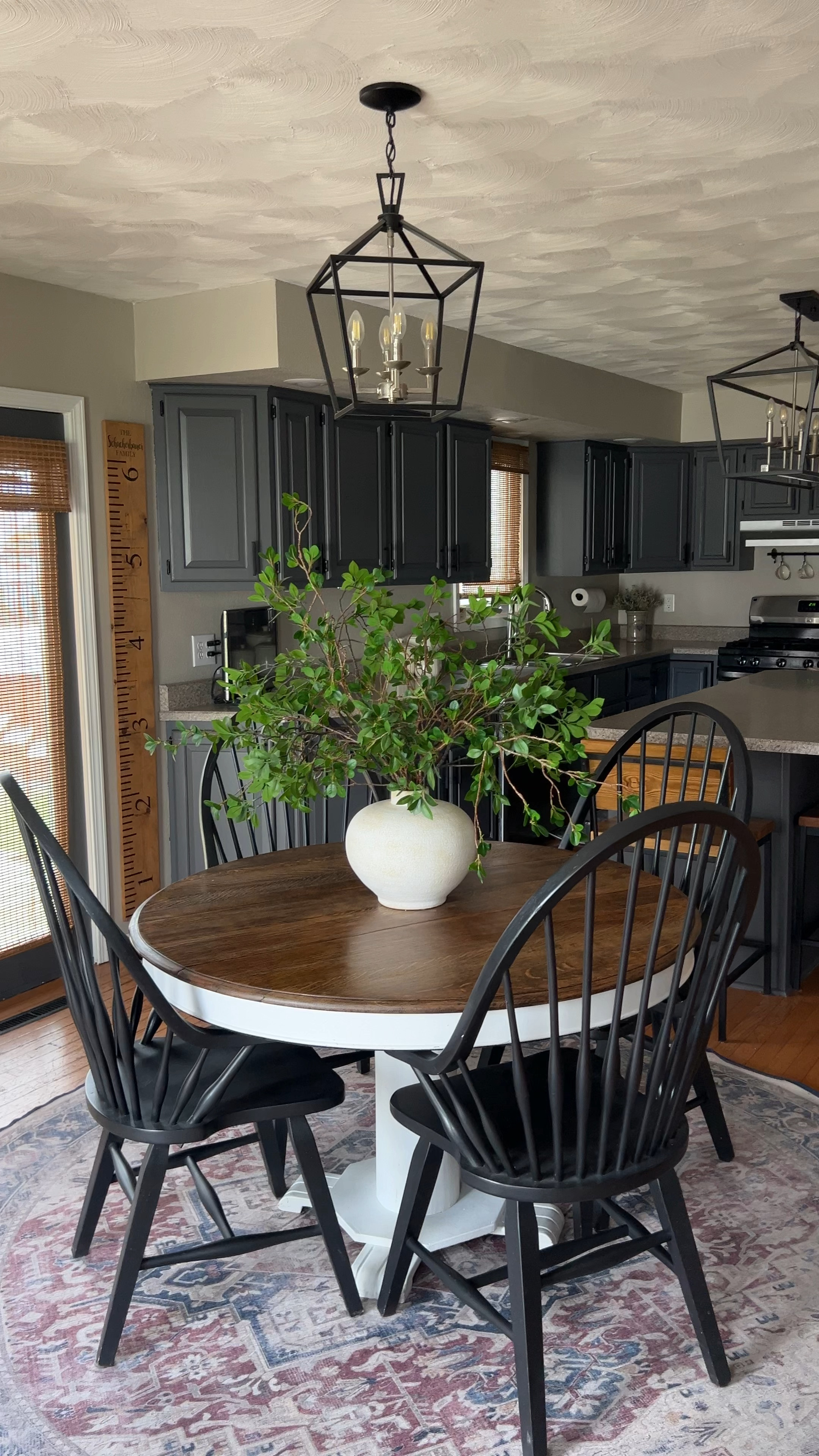 I love my dark and moody kitchen. Painting my cabinets was the best thing I ever did to update the look of my outdated kitchen. Now there’s a more vintage aesthetic. A little traditional modern farmhouse with a hint of transitional and contemporary design. 

Be sure to follow @elevatedneutrals on IG, FB & Pinterest for more home inspiration.

Rustic Dining Room Inspiration | 
Transitional Dining Room | Moody Dining Room | Modern Farmhouse | Traditional Design | Vintage Rug | Round Pedestal Dining Table | Modern Pendant Lighting | Dining Centerpiece | Oversized Floral Arrangement | Counter Stools | Black Modern Dining Chairs | Windsor Dining Chairs | Sherwin Williams Peppercorn Doors | Ruggable Rug | Kamran Coral Rug |

#LTKVideo #LTKHome