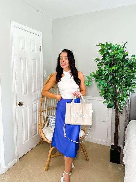 Under $50 amazon satin midi skirt (small, multiple colors), under $20 amazon cross neck tank (small, 5+ colors), under $45 amazon white block heels (tts, 5+ colors) and under $45 amazon designer inspired Marc Jacobs bag — the perfect spring event or even work look! Also linking my faux ficus and egg chair! #founditonamazon 

#LTKshoecrush #LTKworkwear #LTKunder50