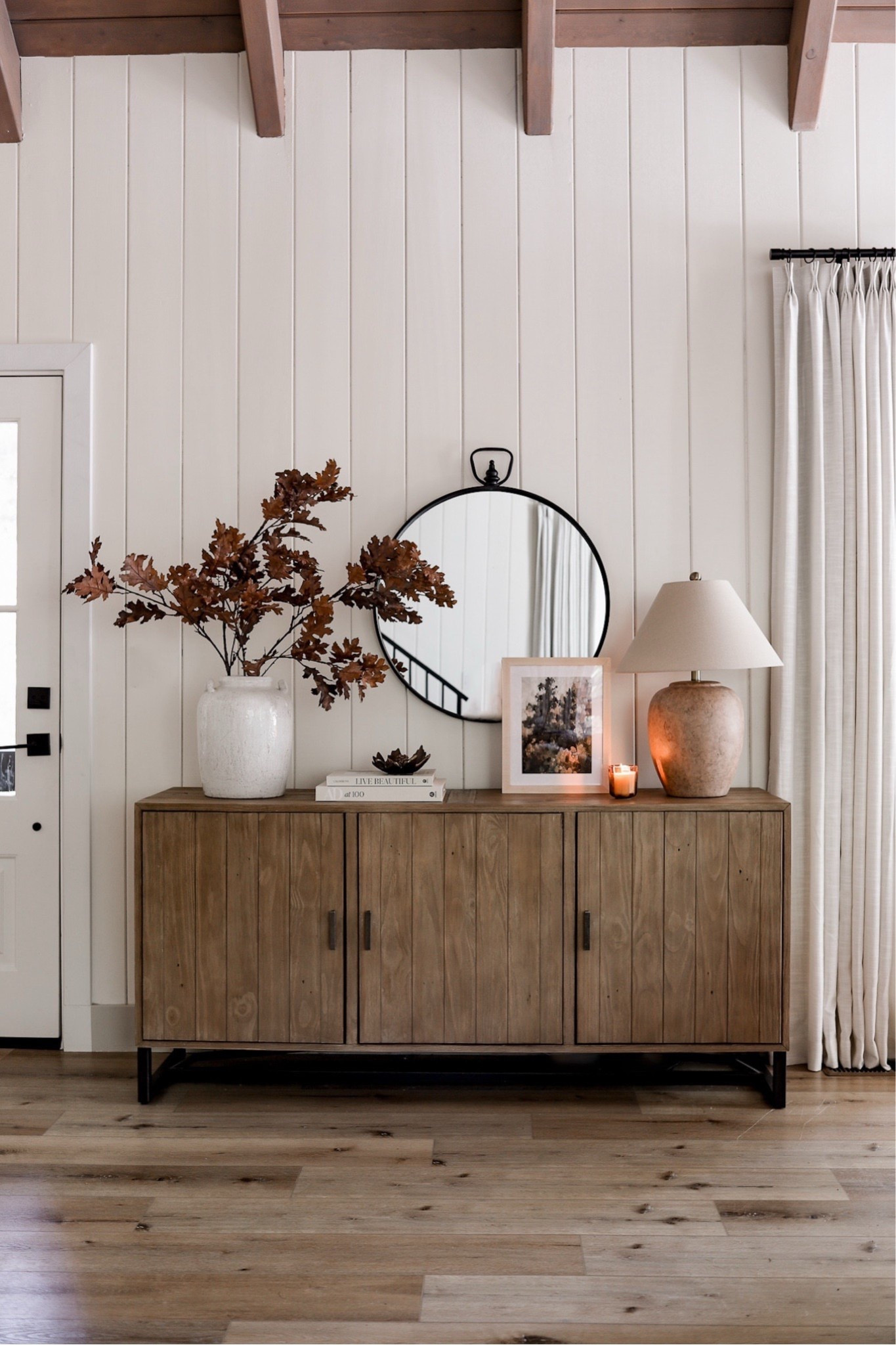 Shop my Autumn entryway complete with this gorgeous sideboard, fall oak stems, ceramic lamp, and favorite curtains! 

 #ltksalealert #ltkseasonal #ltkhome