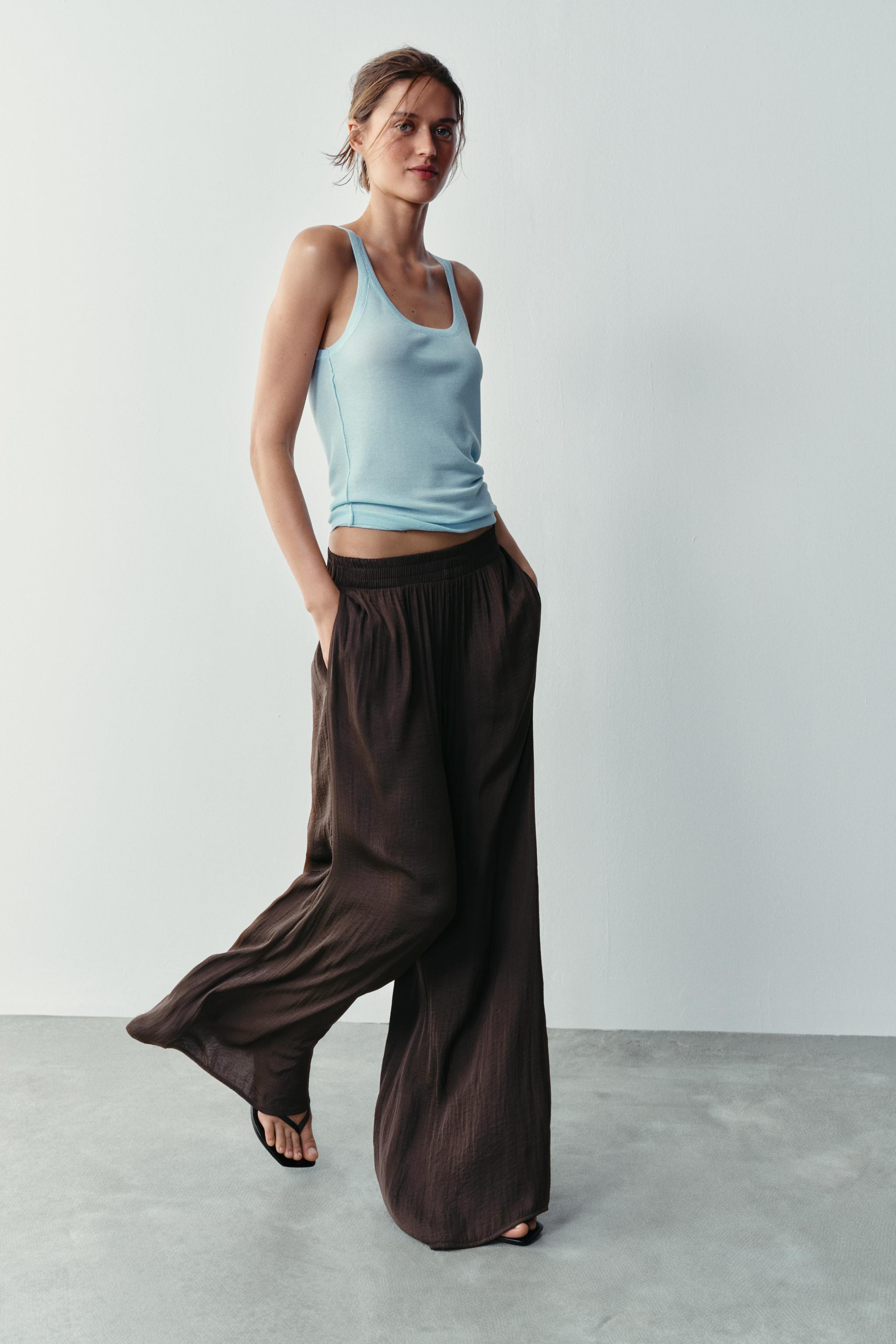 High-waist trousers with an elastic waistband and front pockets. Featuring a wide-leg design. | Zara UK
