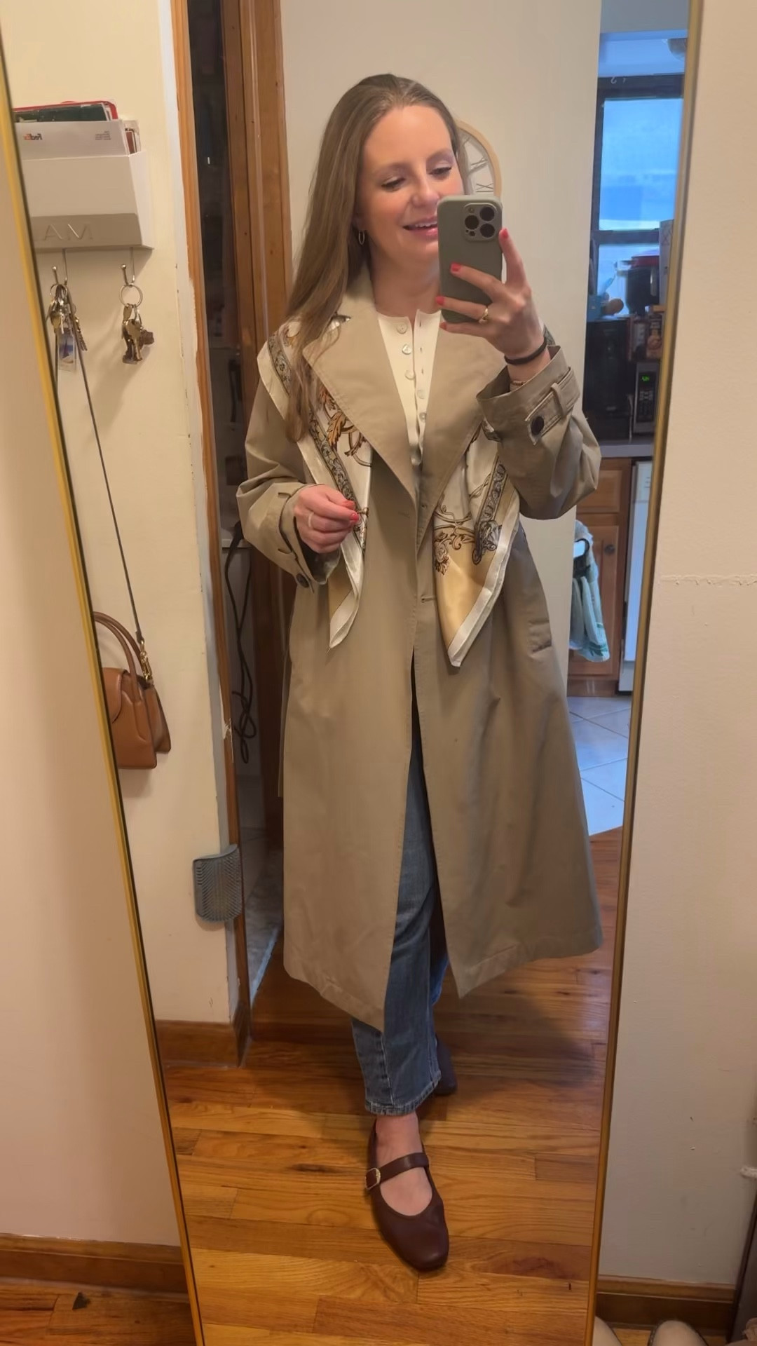 Styling a scarf over my trench coat for a chic outerwear look for spring. My scarf is under $10 from Amazon! 

Scarf, scarves, spring trends, spring 2026
