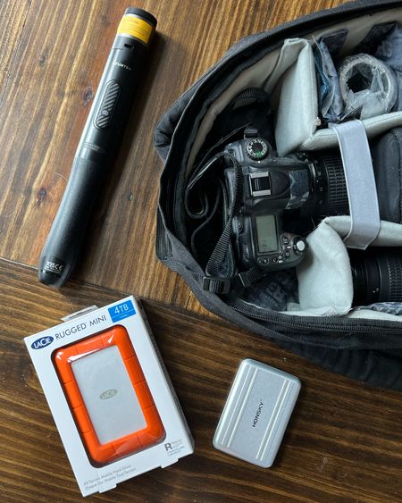 Essentials for traveling with camera gear. I’ve linked to a few camera backpacks and some camera sleeve options if you’re throwing your camera in a regular backpack. Also my favorite compact phone tripod, memory card holder, and rugged hard drive that can withstand being thrown around  

#LTKCyberWeek #LTKitbag #LTKtravel