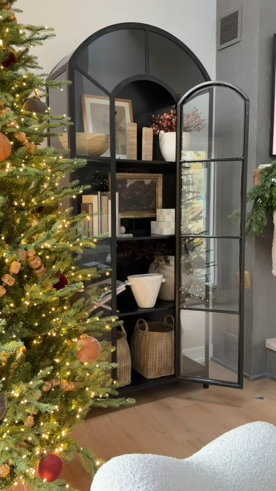 I love this view ✨ The coziness of the tree and lights paired with one of my favorite furniture pieces! 

#LTKHome #LTKHoliday