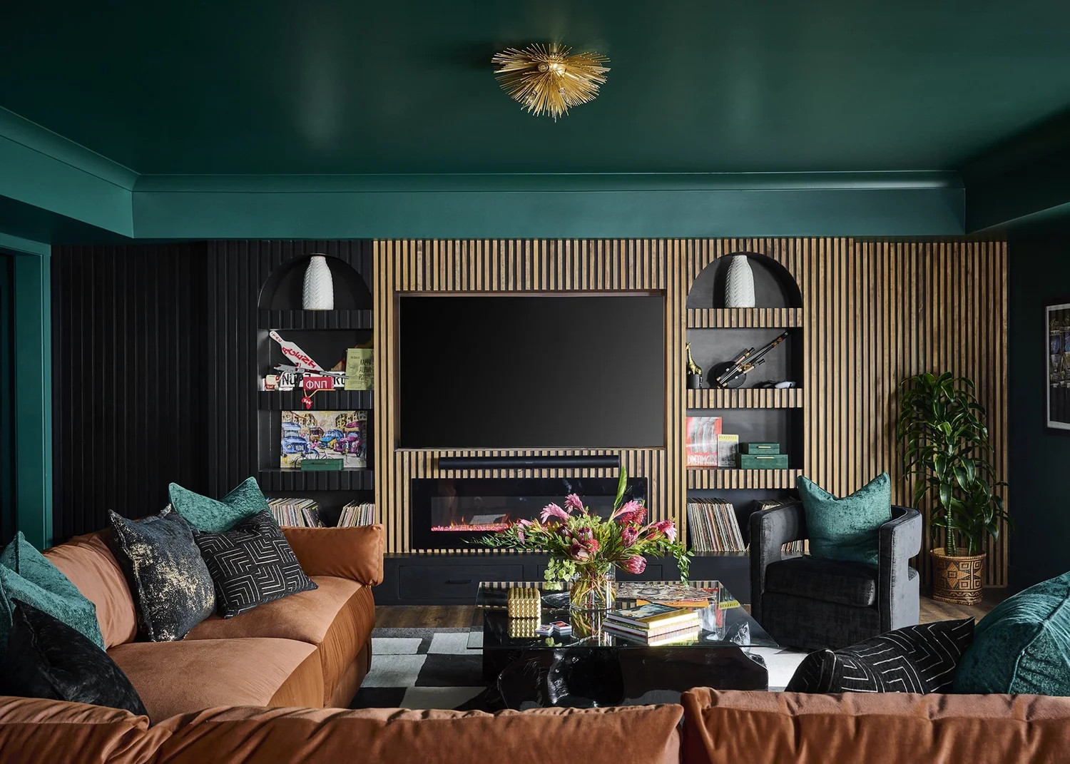 A basement turned vibrant family retreat 🎨 From moody hues to culturally inspired details — this was all about celebrating heritage and making a joyful space. What color would you pick for your cozy escape? #BlessedLittleBungalow #HomeDecor #InteriorDesign 

 #LTKHome