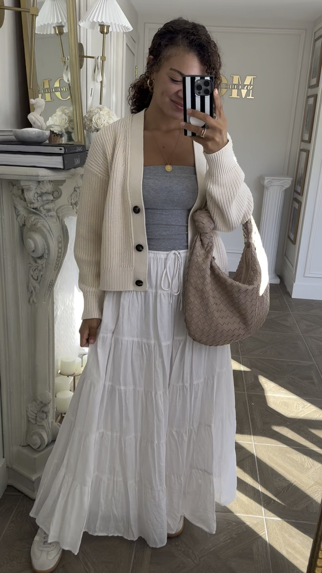 Casual cute weekend outfit idea: tiered maxi skirt, adidas samba sneakers, tube top, knit cardigan, a woven bag, and jewelry. A maxi skirt with an elastic waist jacket comfortable but looks so cute! Mine is from Dissh but sold out, so linking other options for you. Linking similar shoes. Wearing a small in the top and cardigan. 

#LTKVideo #LTKFindsUnder100 #LTKStyleTip