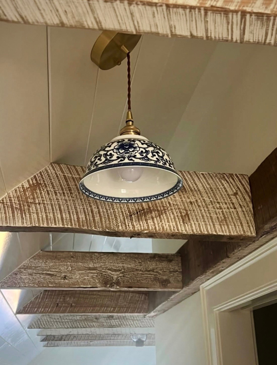 So many questions about this little blue and white bowl pendant light tucked in between the attic beams. I thought it was the perfect little accent light. It comes in three sizes, this one is the smallest available. The cord is perfect for a sloped ceiling and can be cut to fit your space. A bargain that’s getting so many compliments! 

#LTKGiftGuide #LTKCyberWeek #LTKHome