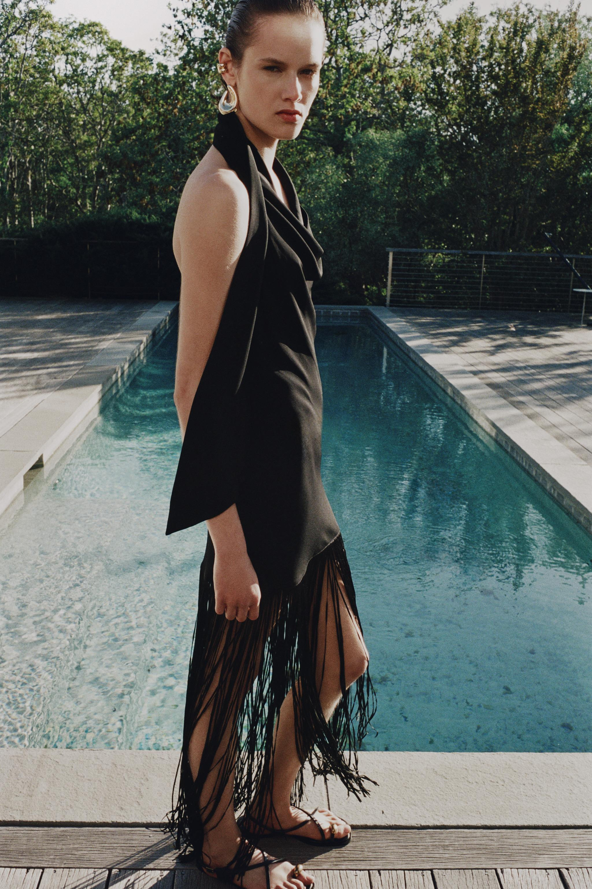 ZARA WOMAN COLLECTIONHalterneck dress with main fabric made from a viscose blend yarn. Fluid neck... | Zara SE