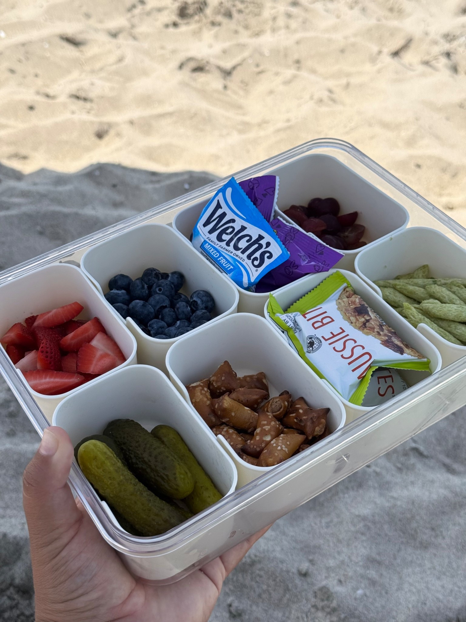 finally got a snackle box & color me obsessed! easy to clean, perfect amount of compartments and comes with tiny forks 🥒 