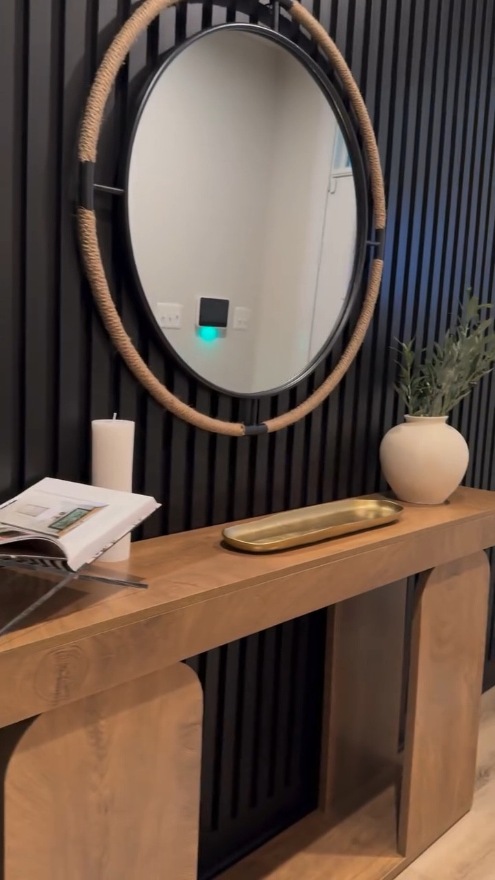ENTRYWAY + OFFICE REVEAL ✨
From basic to bold watch how we transformed my client’s entryway into a modern wow moment using a custom black fluted accent wall paired with a warm wood console table for the perfect balance of texture and tone. 

This moody yet welcoming space flows effortlessly into their newly designed office  as well as their Livingroom space that was previously posted with painted black French doors, new lighting fixtures, and elevated decor details.

This is how you turn transitional into unforgettable. 👏

📍Modern Entryway Design | Black Accent Wall | Home Office Styling
🛋️ Luxury Interior Design | Full-Service Home Styling | Modern Organic Interiors

#InteriorDesign #EntrywayGoals #ModernInteriorDesign #FlutedWall #OfficeDesignInspo #BlackFrenchDoors #LuxurySpaces #TransitionalDesign #WarmModern #HomeTransformation #BeforeAndAfter #SignaturesByKay #InteriorDesignerReel #InteriorDesignVideo #OrganicModernStyle #BlackAndWoodDecor #DesignReveal