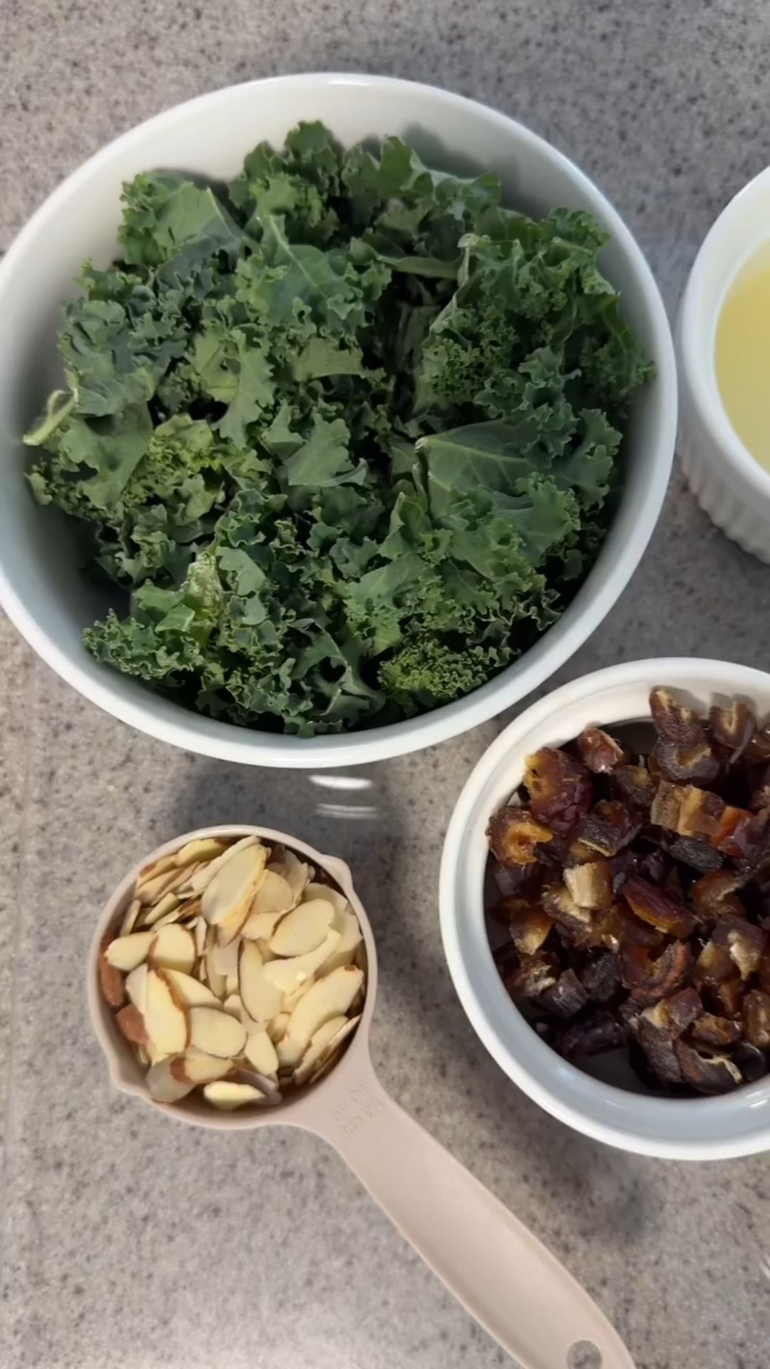 Meghan Markle’s Aegean-Inspired Kale Salad Recipe🥗 This is my favorite recipe of Meghan’s that I’ve made so far in my series. I’m definitely making this salad the next time I’m entertaining family and friends at my home! It was so simple to make but tastes so gourmet! 🫶🏼 @meghan #kalesalad 

Ingredients:
2 bunches of kale
2 tablespoons of extra virgin olive oil
1/2 lemon, juiced
1/2 shallot, chopped
1 teaspoon Greek thyme honey
1/2 teaspoon of sea salt
1/3 teaspoon of red pepper flakes
1/3 cup of sliced almonds
8-10 dried Turkish dates
2 1/2 oz Parmesan cheese, shaved or coarsely grated

Dressing:
In a bowl, whisk the olive oil, lemon juice, shallots, honey, salt and pepper flakes. I ALWAYS use @flatironpepper instead of regular red pepper flakes. They have a much better kick!

Salad:
Mix the kale and chopped dates into the dressing. Add toasted almonds over medium heat in a dry pan until they’re golden. Once they’re toasted, add those and the Parmesan cheese and toss the whole thing together. Enjoy! 🤍
_
#meghanmarkle #meghanmarklerecipe #celebrityrecipes

#LTKFindsUnder50 #LTKFamily #LTKHome