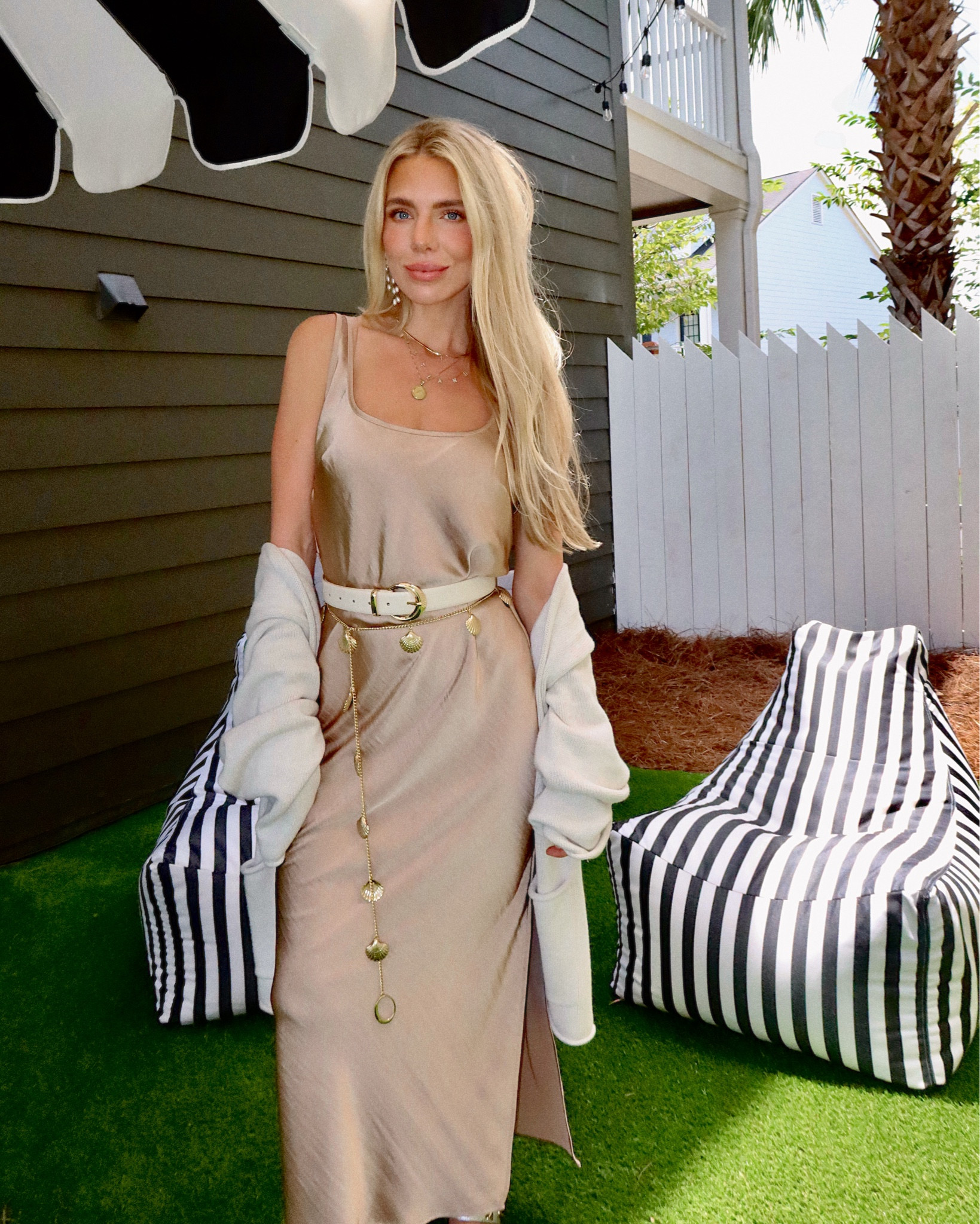 This dress is on sale for $8!!!!!!!! The prettiest gold neutral satin dress from target!!! Such great quality. I need to take up the straps a little personally. Added a belt for structure and the cute shell belt to make it more fun and beachy but it’s such a classic dress. Great for everything from brunch to weddings  Dressed up and down easily. Runs big size XS. 


#LTKWedding #LTKFindsUnder50 #LTKStyleTip