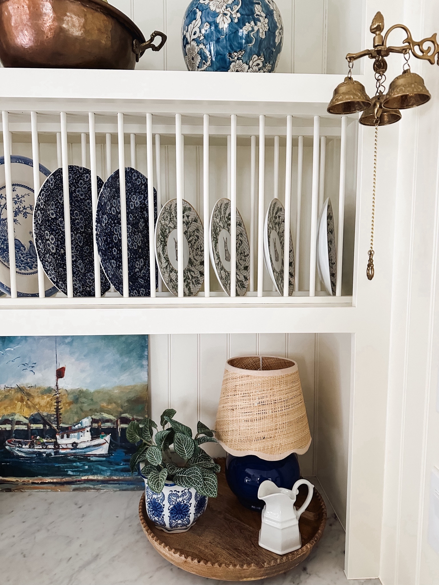 Blue lamp with scalloped jute lamp shade (color options) , planter, plates, wood lazy Susan, brass bells

#LTKstyletip #LTKhome #LTKsalealert