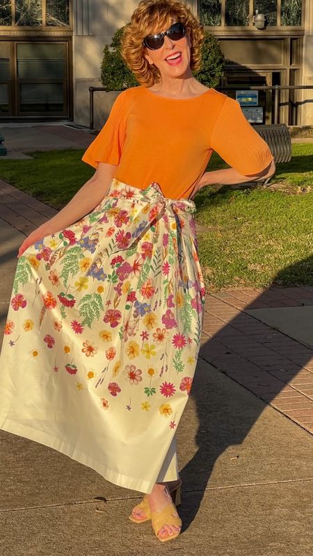 This sateen maxi skirt has me feeling like a princess👑! With a beautiful drape and a gorgeous floral 💐meadow print, it's a show-stopper, for sure! I paired it with a pleated sleeve crewneck tee in melon that emphasized the colors of sunset. 
🌅✨
My pleated sleeve tee comes in 4 colors and my raffia mules are a fabulous #targetfind !


#LTKover40 #LTKshoecrush #LTKVideo