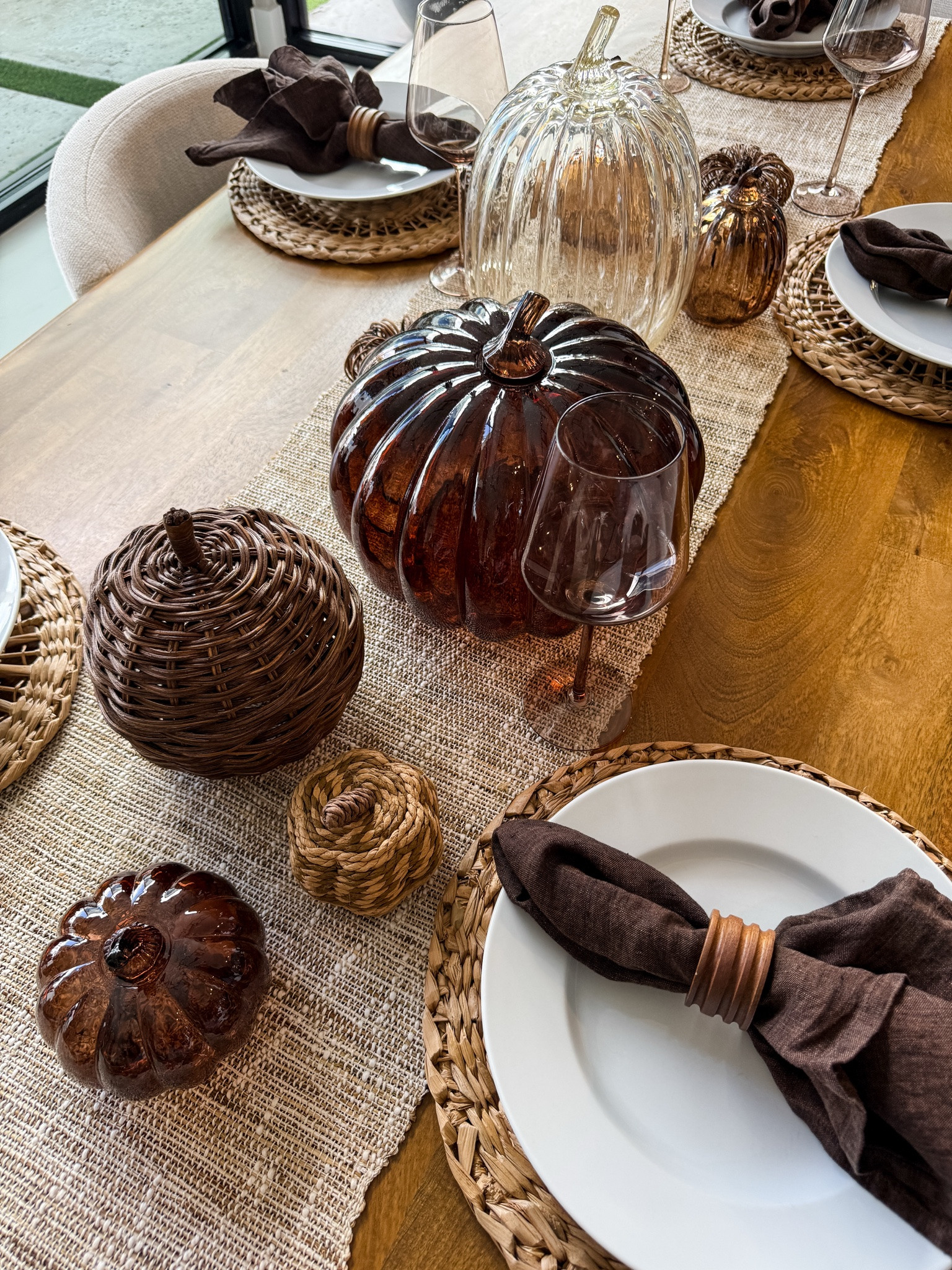 Fall table setting with warm browns, woven textures + glass pumpkins 🤎🍂 #FallDecor #Tablescape

#LTKdayinmylife #LTKSeasonal #LTKHome
