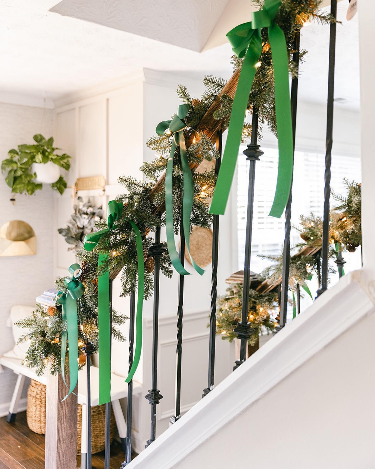 You guys remember when I had the wall taken down on my stairs a couple of months back? Well,my husband said I got the stairs done just so I can hang my garland in time for Christmas. Swipe for the before and then swipe for my response to him. Why can’t people mind their business? 🤷🏾‍♀️

📸 @hannahlozanophoto 
.
.
#stairbeforeandafter #garlandonstairs #christmasgarland #christmasgarlandonbanister