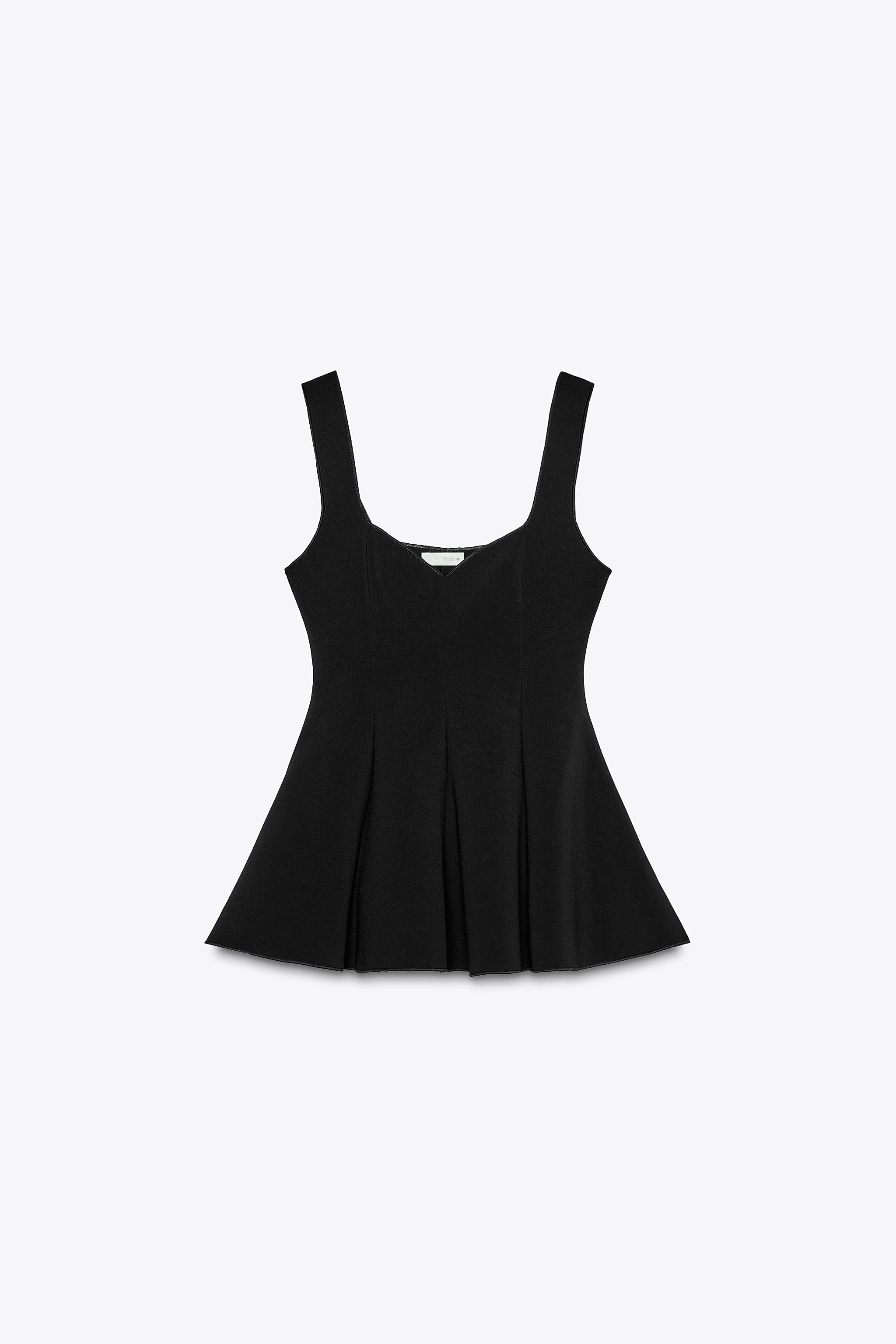 Top made in stretch fabric. Round neckline and wide straps. Peplum hem. | Zara US
