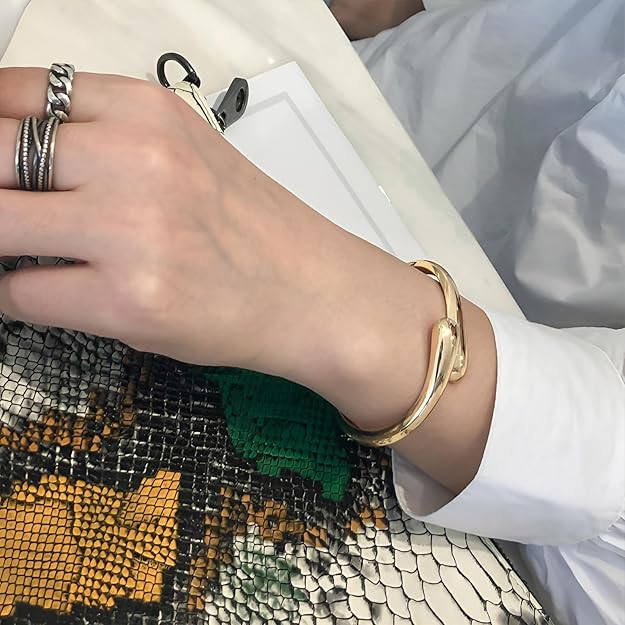 Gold Polished Chunky Twisted Hinged Waterdrop Bangle Bracelet for Women Spiraled Oval Bangle Brac... | Amazon (US)