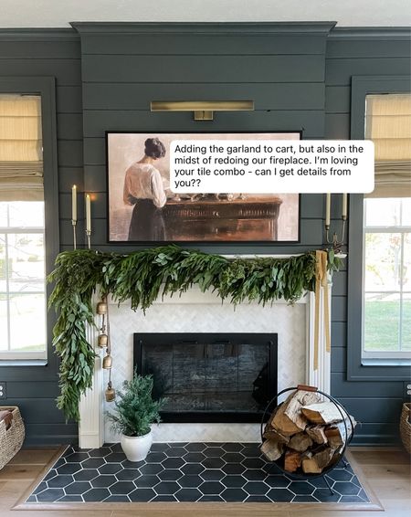 Fireplace renovation/tile sources linked here! The doors were custom made by a local shop. Paint color is Down Pipe by farrow & ball. Picture light is battery operated! (Large size, antique brass.) our frame TV is the 55 inch size. 

#LTKSeasonal #LTKhome #LTKHoliday