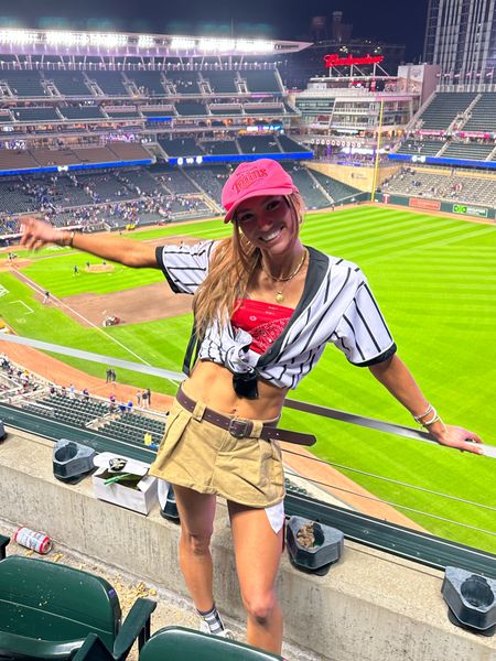 Baseball chic 
Baseball game outfit idea 
Cargo mini skirt baseball shirt, pink sporty hat, Minnesota twins, bandanna shirt  

#LTKfit #LTKstyletip #LTKsalealert