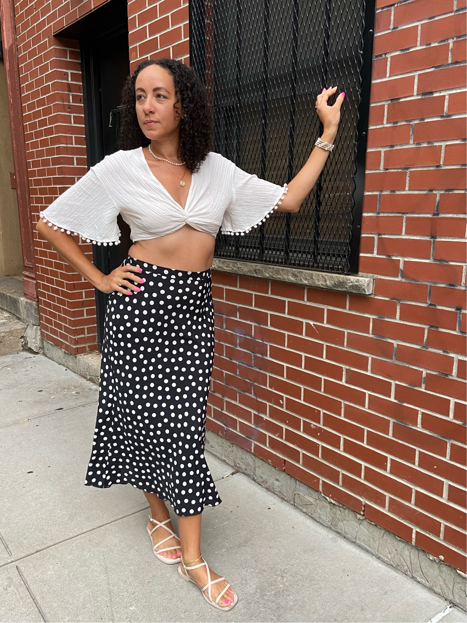 Polka dot skirt. White crop top. Pom Pom crop top. Summer looks. Vacation outfits. 

#LTKSeasonal #LTKtravel #LTKunder50