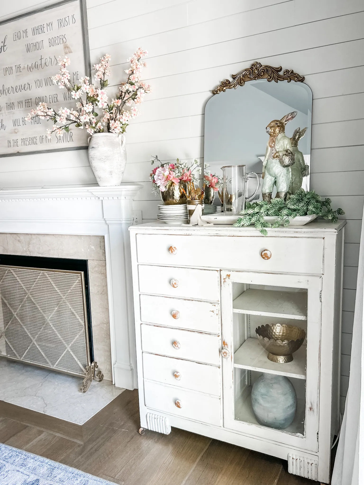 Adding touches of Spring to the dining room! 

Loving our new fire screen to dress up the fireplace! 

Fireplace decor, fire screen, fireplace screen, Easter bunny, artificial hops, artificial stem, Spring greenery, artificial cherry blossom, table mirror, wall mirror, ornate gold mirror, dining room decor, Spring dining room. Faux stem, rabbit decor, flat dough bowl, whitewash rectangular tray, artificial Spring flowers. Spring florals. 
#diningroom #spring #easter 

#LTKhome #LTKstyletip #LTKFind