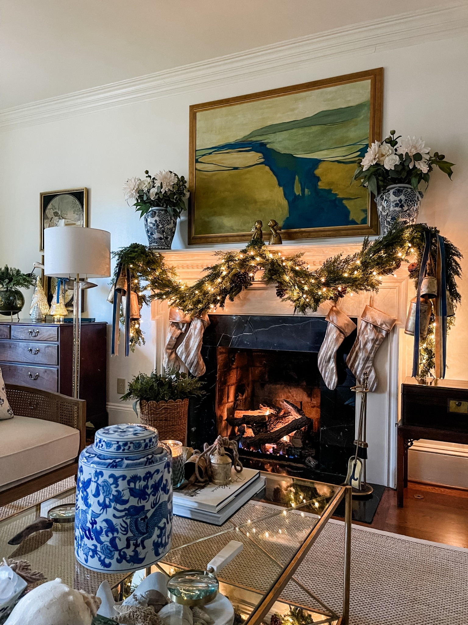 The soft glow of the fire, garland twinkle, and touches of blue and gold — my favorite kind of cozy. ✨

I love how this look bridges late fall and the holidays with just the right balance of warmth and polish. 🎄

Classic pieces like ginger jars, brass accents, and layered greenery make it easy to decorate once and enjoy all season long. ✨

Shop the timeless staples that create this look — from the garland and stockings to the blue-and-white accents — all linked for you on my LTK. 🎄

#LTKSeasonal #LTKHome #LTKHoliday