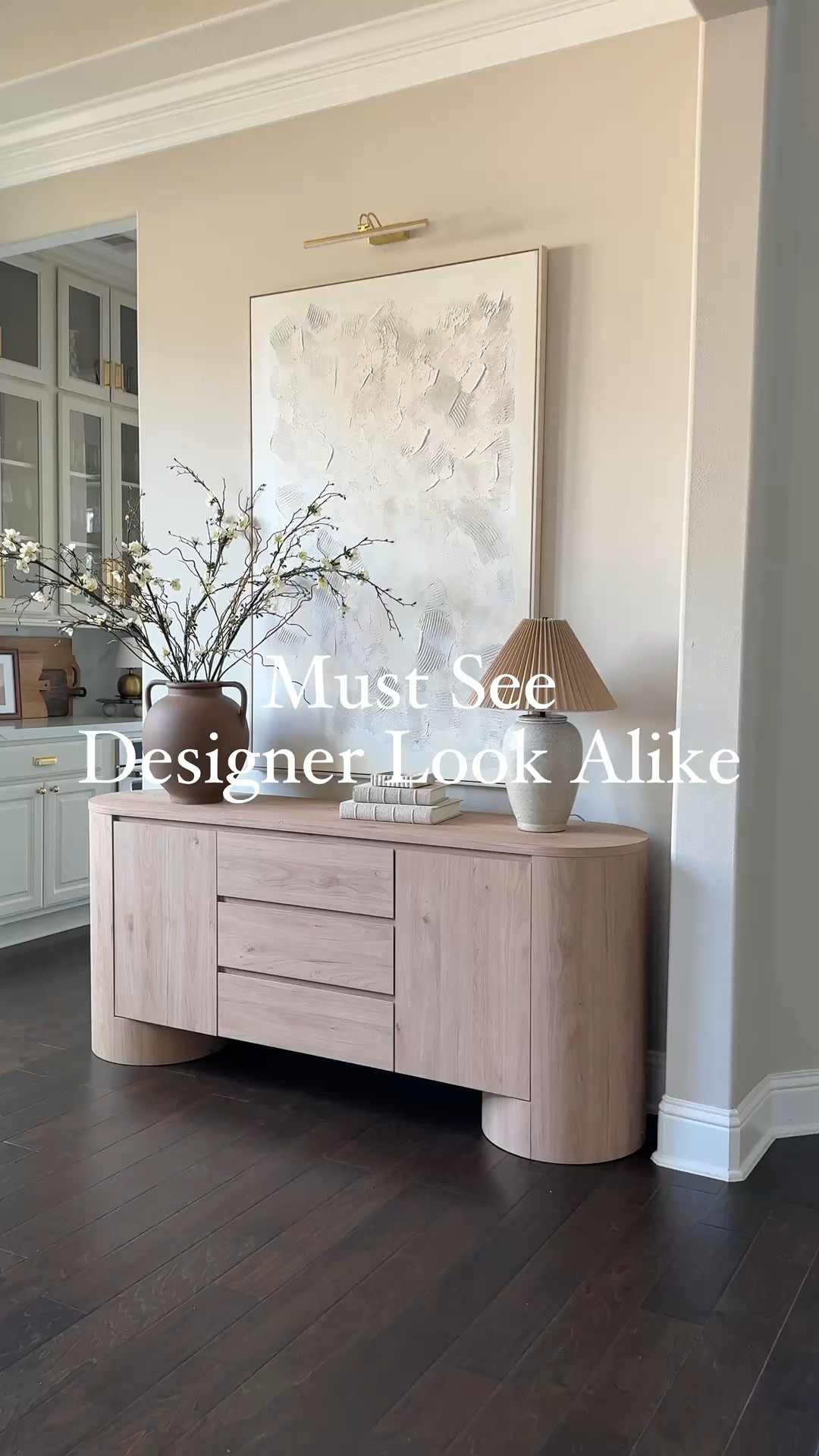 You won’t believe the price on this designer look alike. This sideboard has a stunning modern organic aesthetic with a sleek yet warm presence. It’s almost identical to the designer version but of course without the price!! Amazon home 

It’s a perfect blend of high-design meets approachable luxury, making it a statement piece that feels both timeless and on-trend. #LTKWatchNow 

#LTKHome #LTKSeasonal #LTKStyleTip