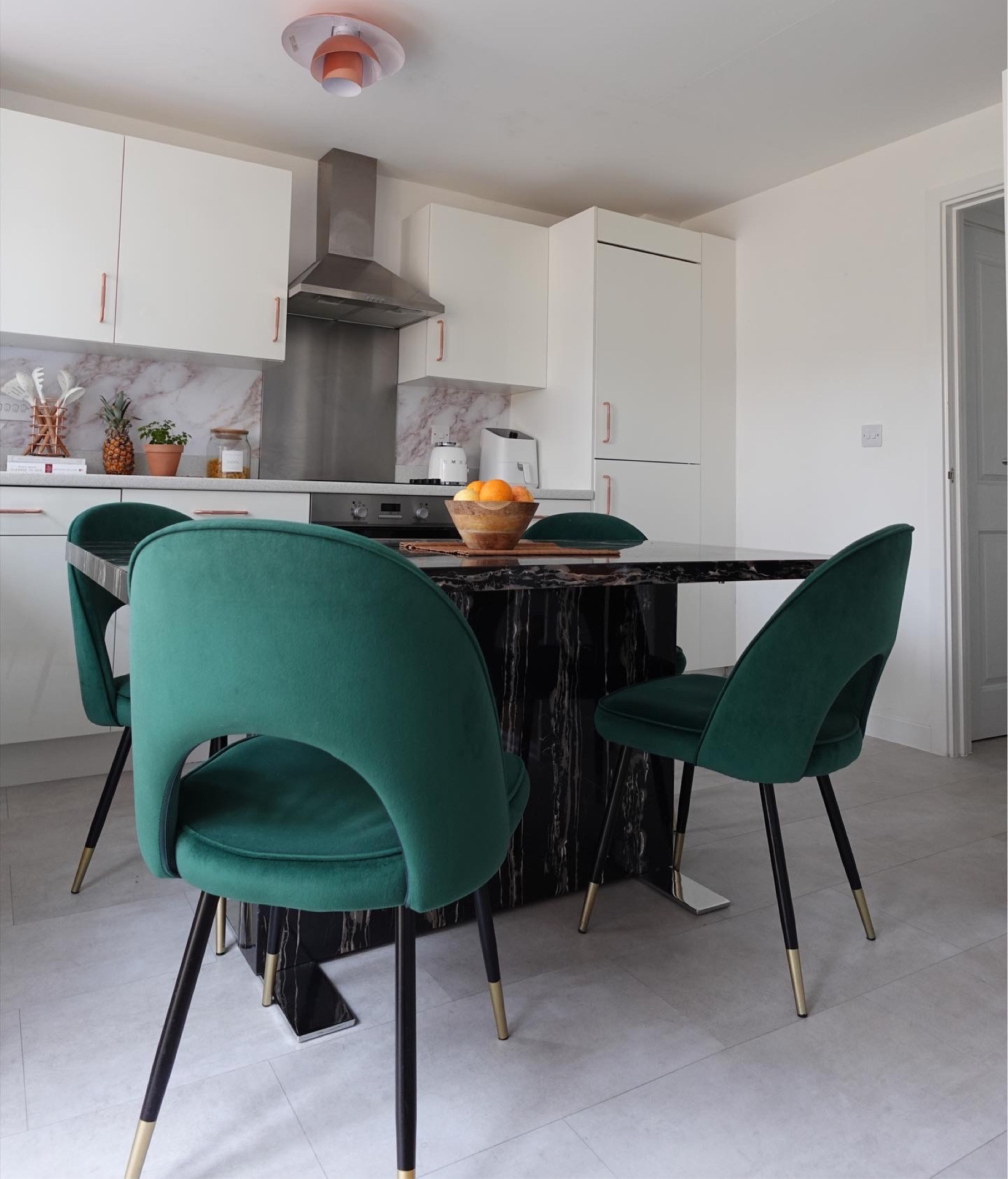 Black marble dining table styling with green chairs

#LTKhome #LTKstyletip #LTKFind