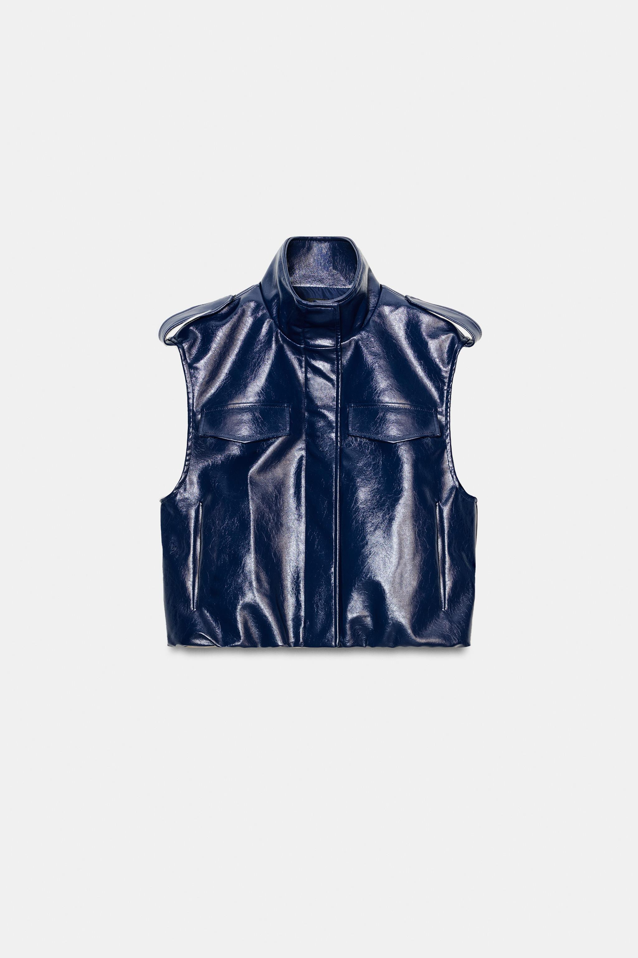 High collar vest with armholes and shoulder loops. Side pockets and faux flap pockets on chest. P... | Zara US