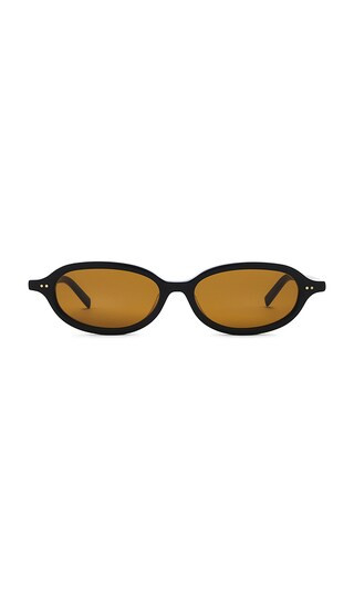 St. Agni 90s Slim Oval Sunglasses in Black. | Revolve Clothing (Global)