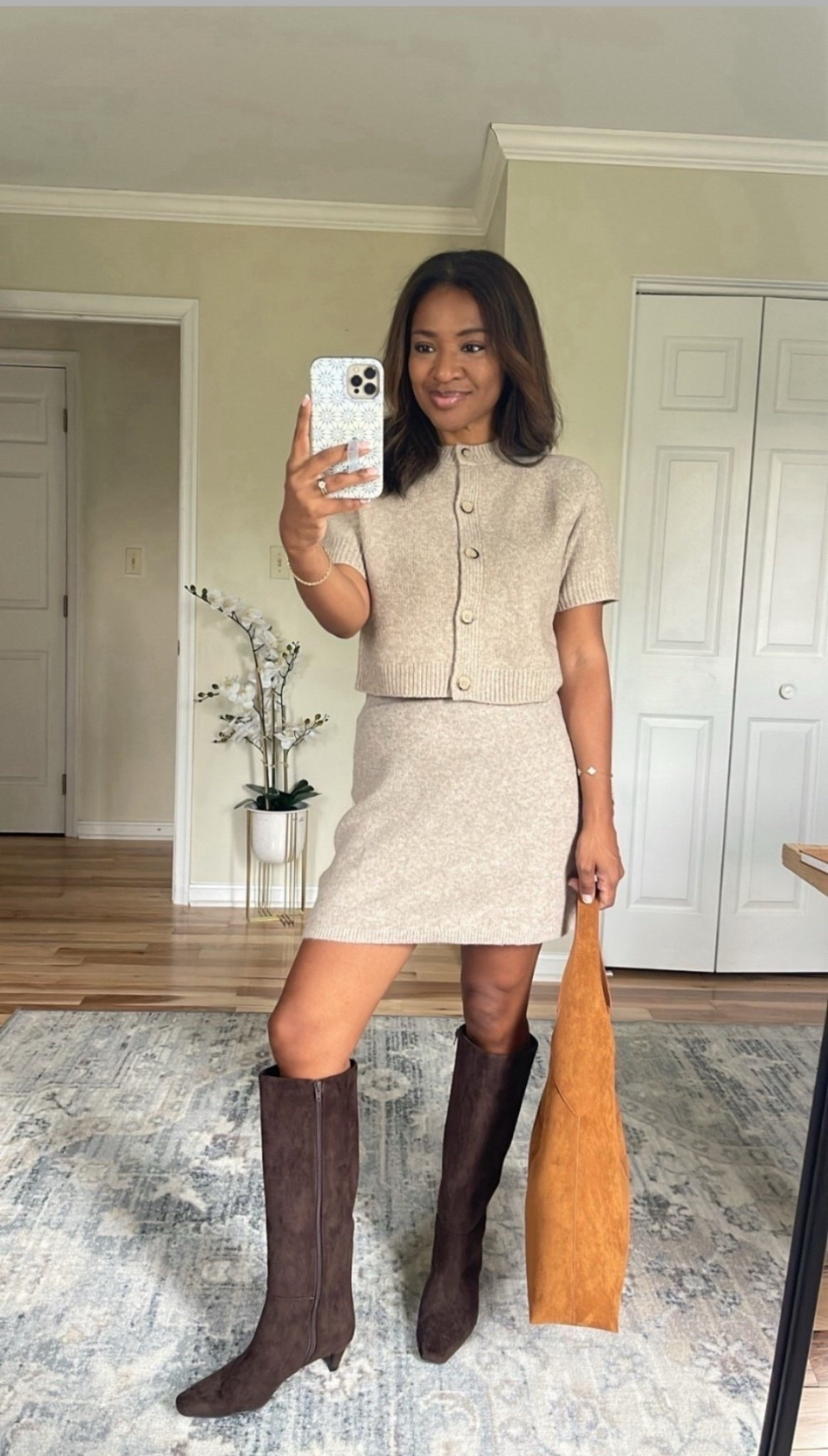 This sweater cardigan and skirt looks so cute together! Wearing a small in both 

 #ltkfindsunder100 #ltkover40 #ltkfindsunder50

