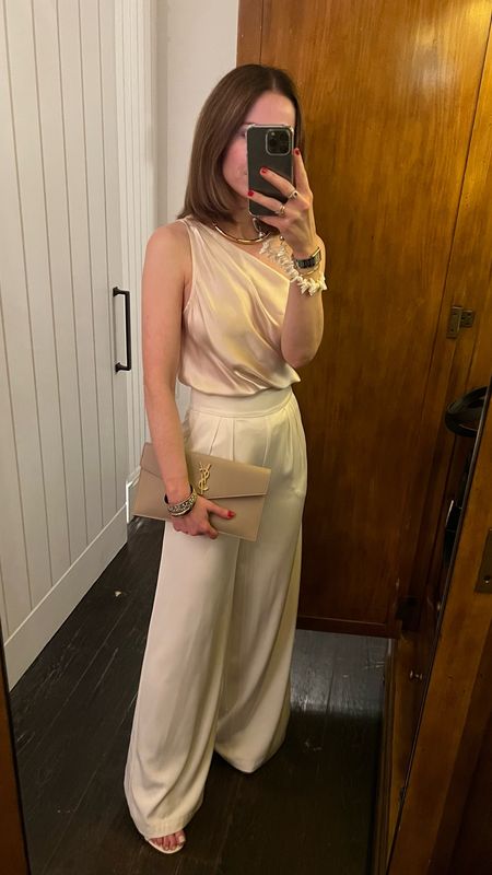 Dinner date night outfit in NYC
Wide leg white trousers House of Harlow Old
Silk one shoulder bodysuit CAMI nyc 
Beige YSL clutch
Larroude Slingback heels
Ossa New York Phone chain

#LTKShoeCrush #LTKItBag #LTKStyleTip
