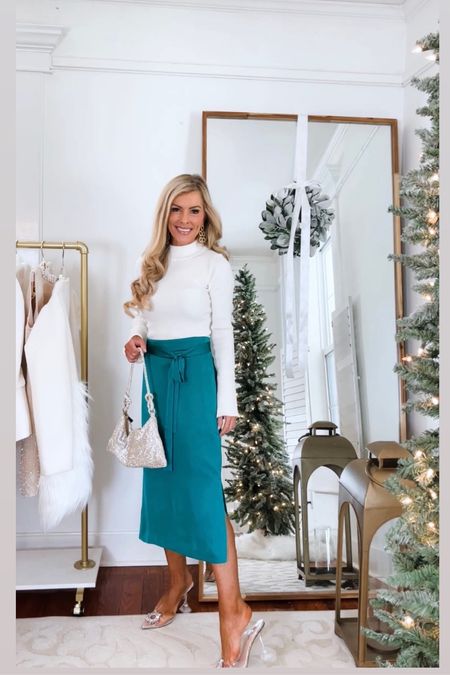 Holiday outfit 

Green tie waist satin skirt : 00 petite
White crystal embellished button sweater : xxs
Crystal embellished clear heels : sized down as back strap ran larger 

#LTKSeasonal #LTKHoliday #LTKCyberWeek
