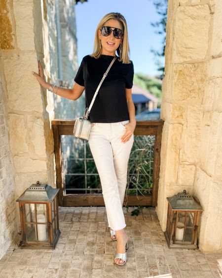 I love the simplicity of this outfit-basic black and white with pops of silver. The white jeans are a bestseller-I can’t recommend them enough-and the top is an old favorite that has a zip up the back to get it on and off without messing up your hair or getting makeup on it. It’s also easy to zip without help. You can get it 10% off with code MARNIExSPANX. I decided to wear all silver accessories-the shoes are really budget friendly and the bag was my birthday present! There are lots of ways to add silver (or gold) metallics into an everyday outfit, but the easiest way is through accessories!

#whitejeans, #silverpurse #silvershoes #springoutfit #datenight #fashionover40 #fashionover50 #sandals #aviators #crossbodybag #tophandlebag 

#LTKstyletip #LTKshoecrush #LTKover40