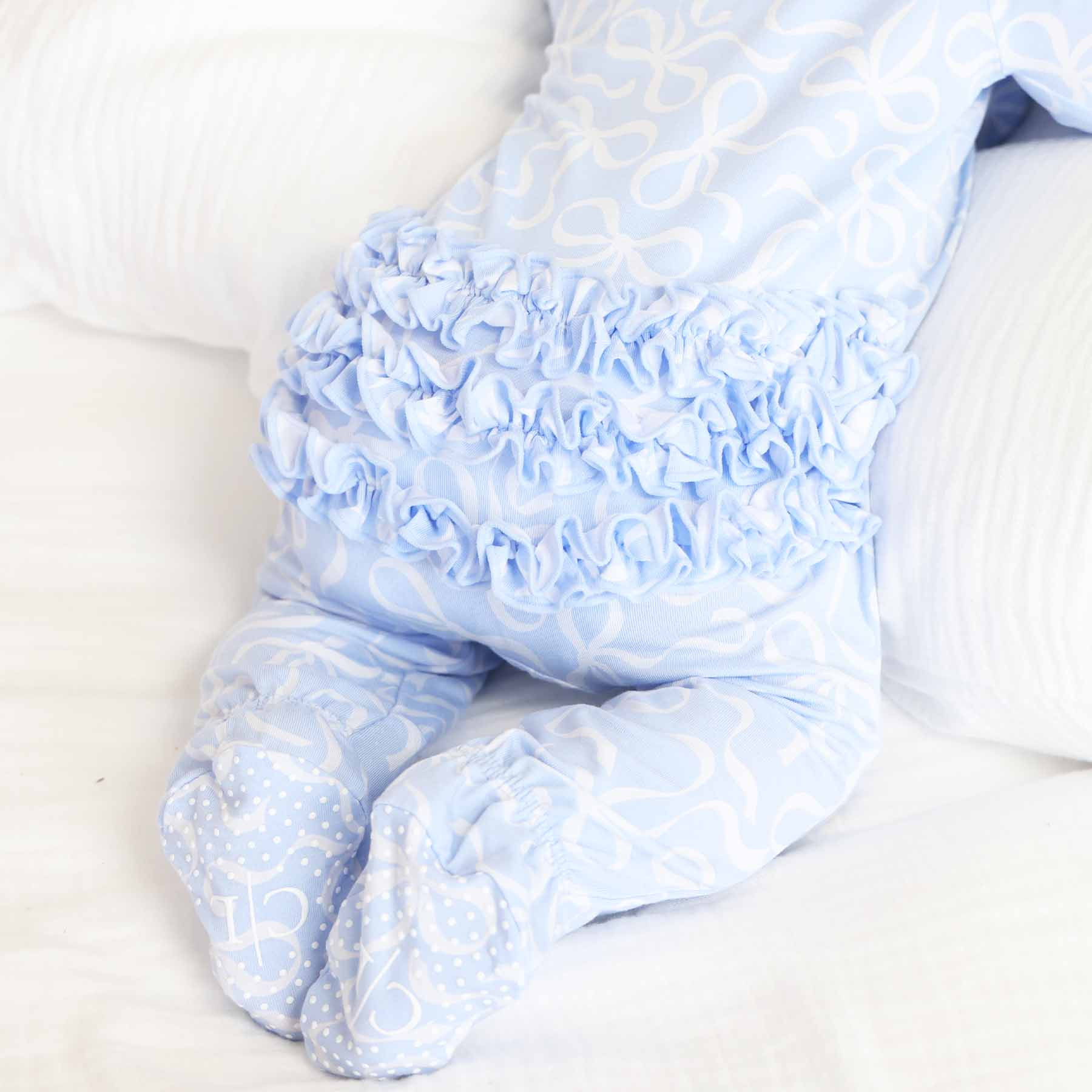 Blue-tiful Bows Ruffle Zipper Footie | Caden Lane