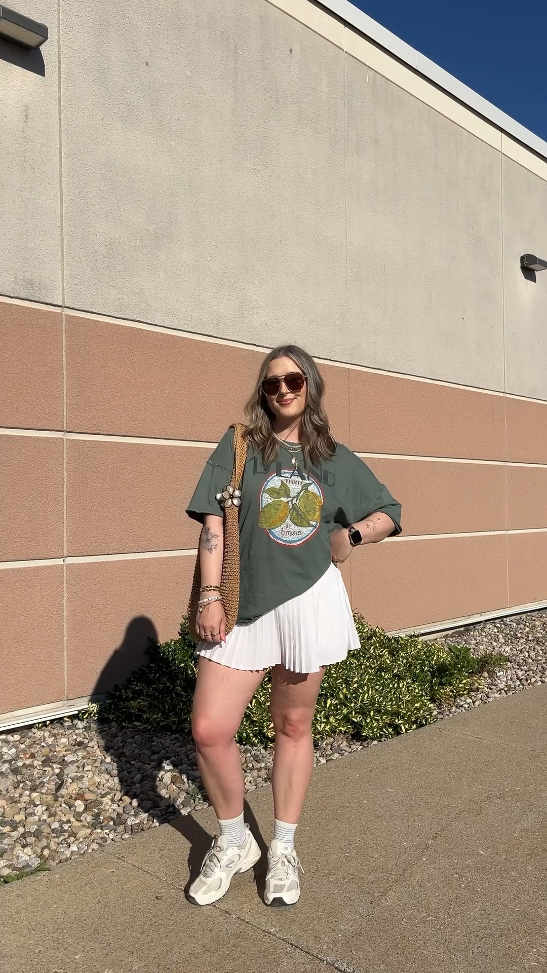 Casual spring to summer outfit! Wearing my usual size L in the graphic tee. Wearing M in the white tennis skirt, I bought it years ago & if I was ordering now I’d get L although M still fits. New Balance sneakers run a little big, I’m a 9.5-10 and wear a 9

#LTKsummer #LTKsale #LTKmidsize