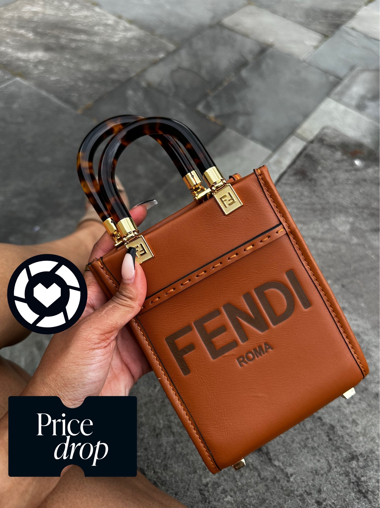 Fendi Mini Sunshine Shopper Tote in brown leather with tortoise-effect plexiglass handles. It features heat-stamped Fendi Roma lettering, gold-tone hardware, and a detachable shoulder strap. Do we love?

#LTKSeasonal #LTKSaleAlert
